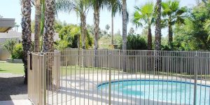 white iron pool fence